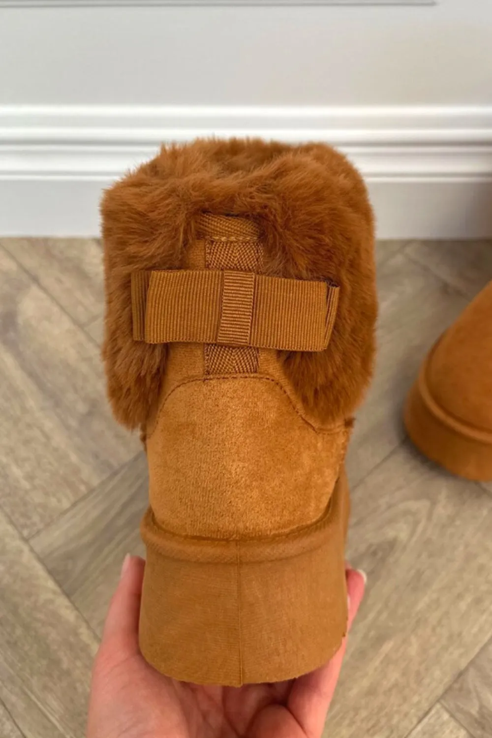 GLORIA SLIP ON ANKLE BOOTS WITH FAUX FUR AND BOW DETAIL IN BROWN SUEDE